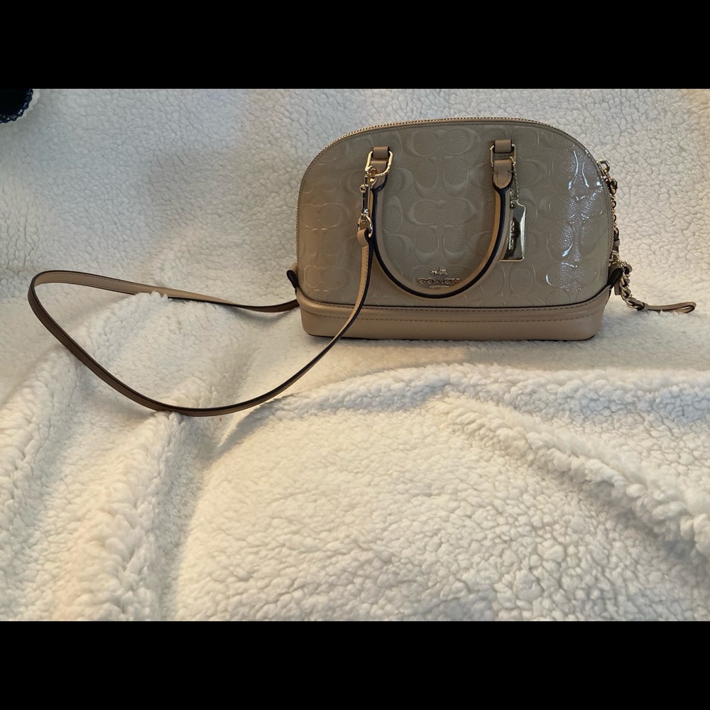 Coach hand/ cross body bag light beige color